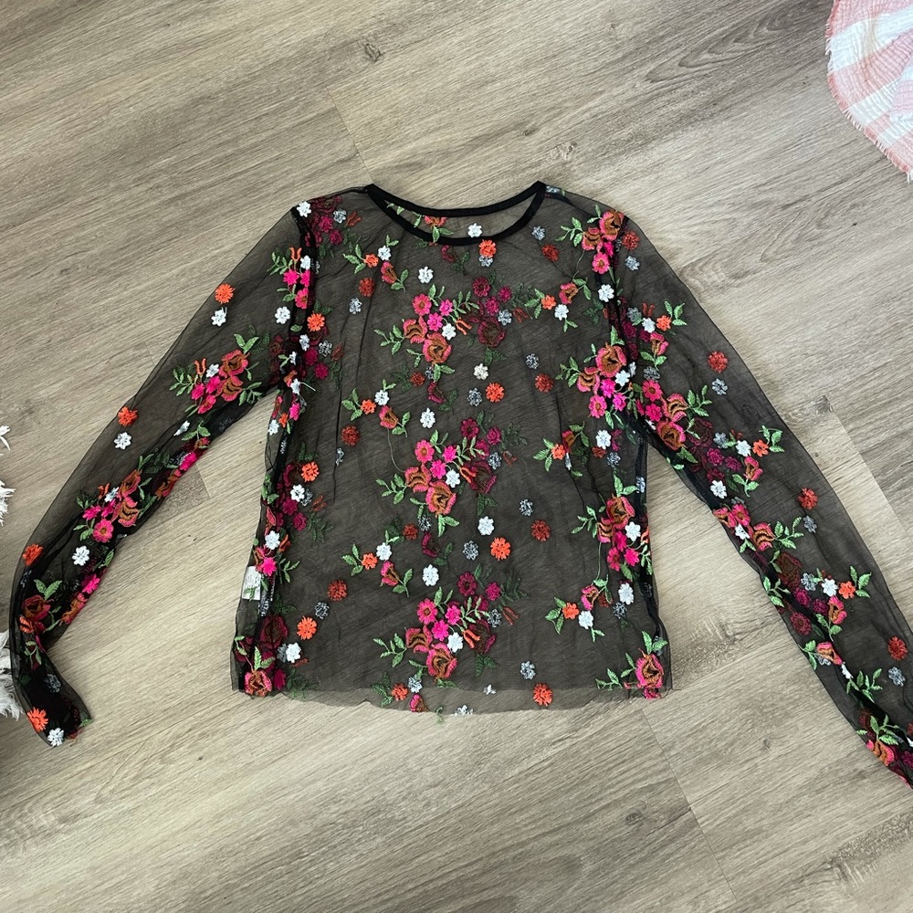 Cute black sheer top! Perfect for a night out :)